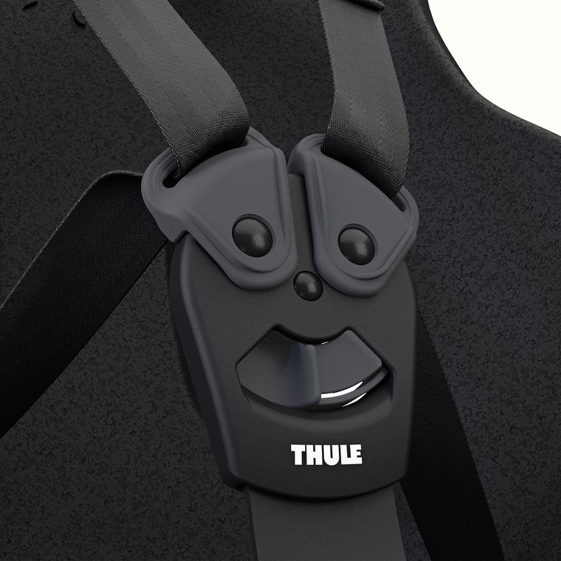 Close-up of the Black Thule Yepp Nexxt 2 Maxi Child Bike Seat's safety harness with a Thule label.