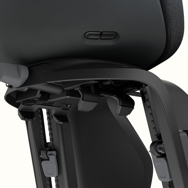 Close-up of Black Thule Yepp Nexxt 2 Maxi Child Bike Seat on a white background.