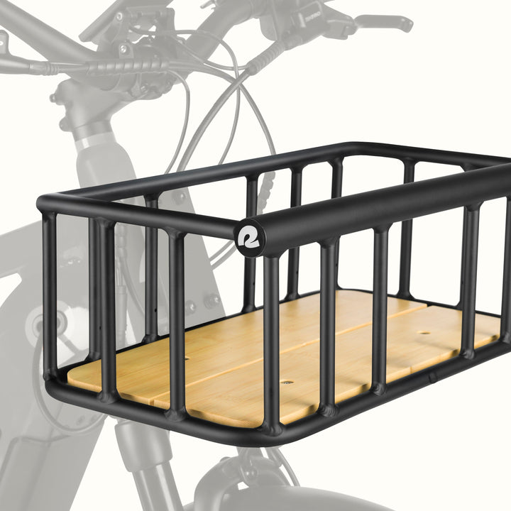 retrospec Tote Plus Electric Bike basket mounted on the front of a black Electric Bike, angled view.