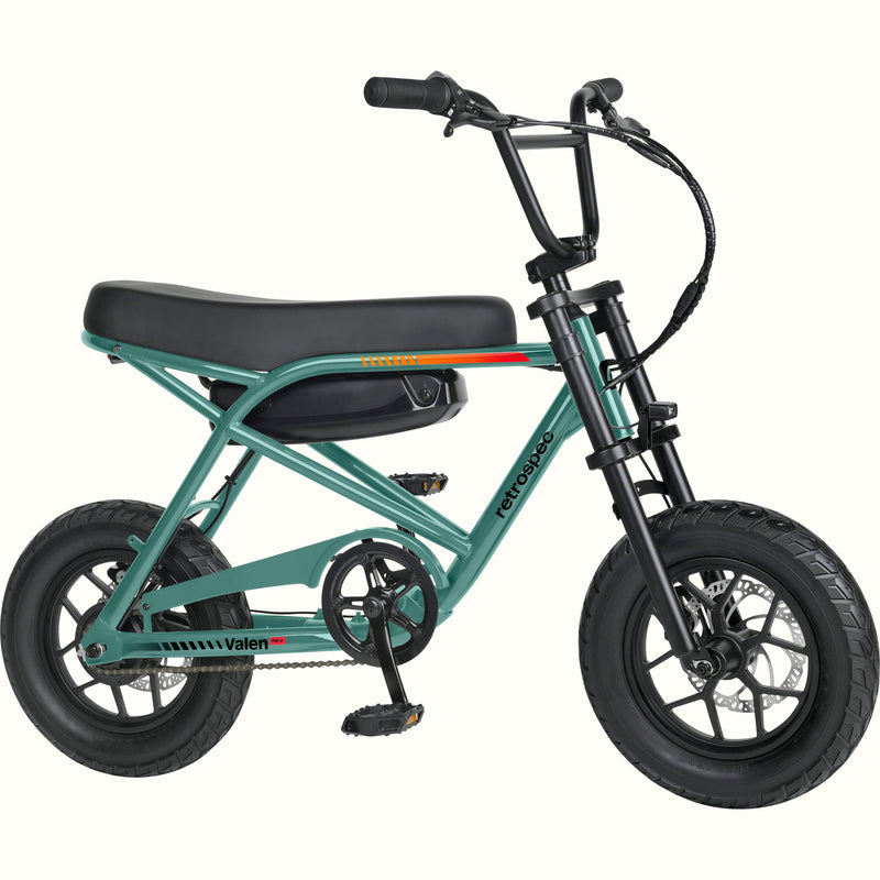 A mini electric bicycle with a green frame, black seat and tires, and a black battery pack mounted on the rear frame, shown against a plain white background.