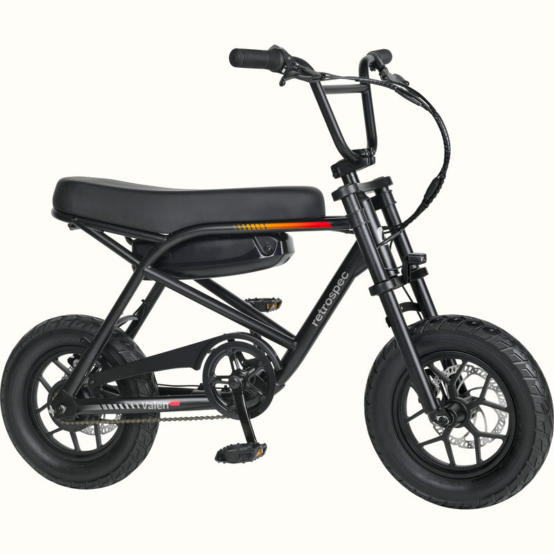 A mini electric bicycle with a black frame, black seat and tires, and a black battery pack mounted on the rear frame, shown against a plain white background.