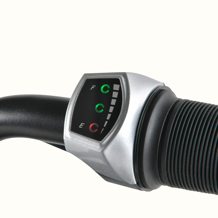 Close-up of a mini electric bike handlebar Display module with a black and silver housing, showing illuminated green and red indicator lights on a white background.