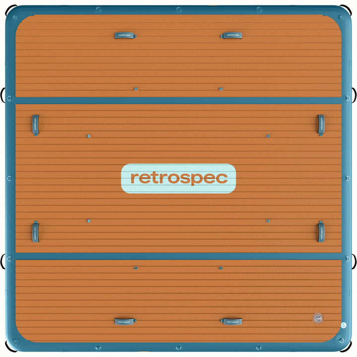 Top view of the Siesta Dock XL Inflatable Platform 10' with a large retrospec branded logo in the center of the wood textured deck pad.