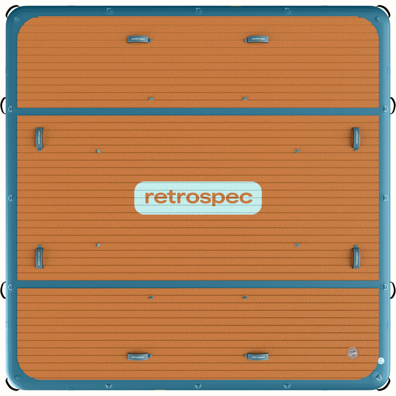 Top view of the Siesta Dock XL Inflatable Platform 10' with a large retrospec branded logo in the center of the wood textured deck pad.