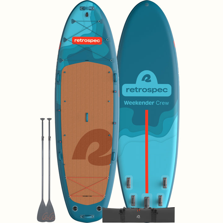 The front and back of the Weekender Crew Multi-Person Inflatable Stand Up Paddle Board 12’ in blue with red accents and shown with two paddles and a dark grey carry bag.