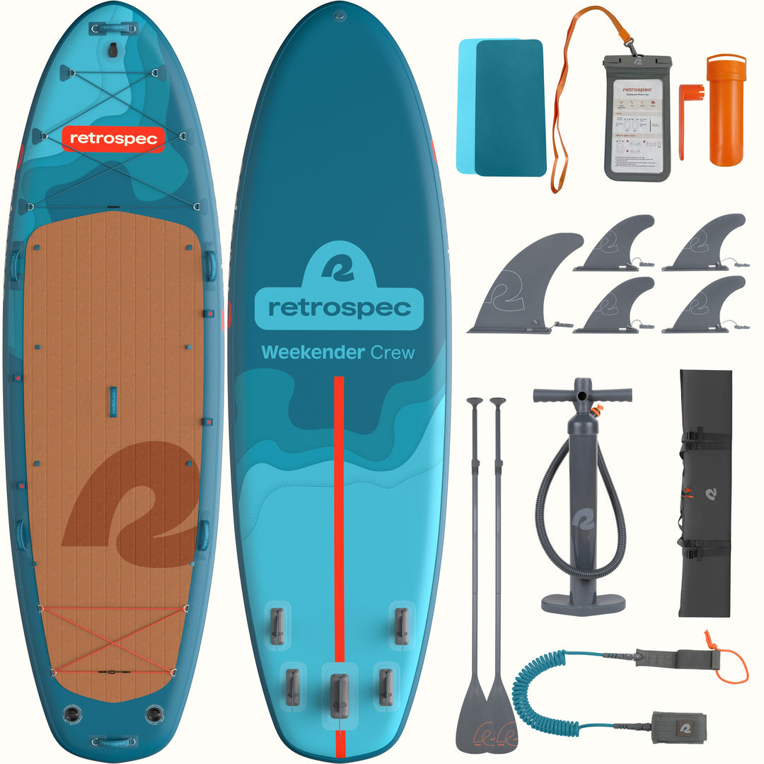 The front and back of the Weekender Crew Multi-Person Inflatable Stand Up Paddle Board 12’ in blue with red accents shown with accessories on a white background.