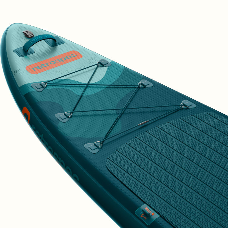 Teal inflatable paddle board with 'retrospec' branding on a white background.