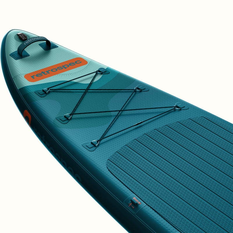 The nose of the teal Weekender Tour XL inflatable paddleboard with 'retrospec' branding and a 6-point bungee on a white background.