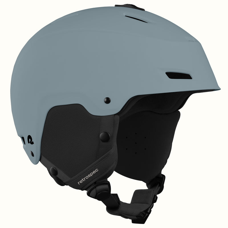 Close-up angled view of the retrospec Zephyr mens ski helmet in Matte Arctic Dusk highlighting its logo and fit dial.