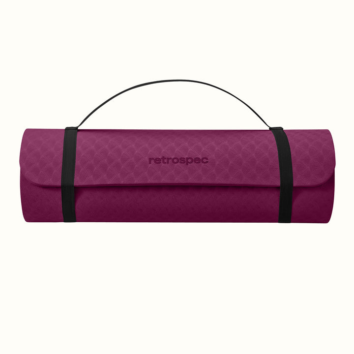 Boysenberry rolled-up yoga mat with carrying strap and "retrospec" logo on a white background.