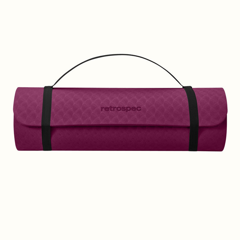Boysenberry rolled-up yoga mat with carrying strap and "retrospec" logo on a white background.
