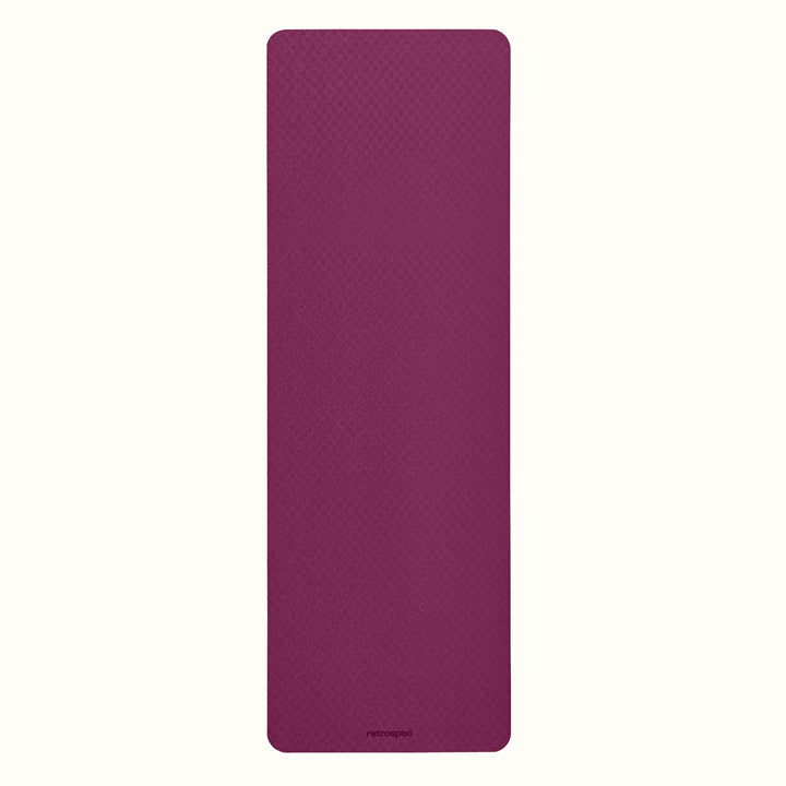 Boysenberry Zuma Yoga Mat with textured surface on a white background.