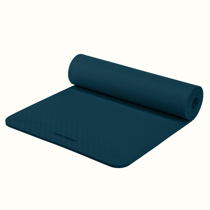 Partially rolled out Ocean Blue Zuma Yoga Mat with textured surface on a white background.