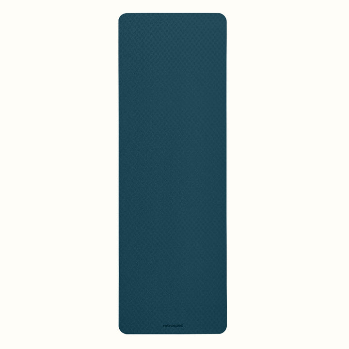 Ocean Blue Zuma Yoga Mat with textured surface on a white background.