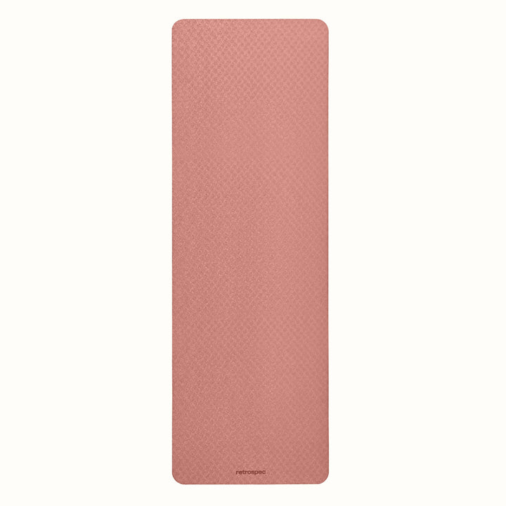 Rose Zuma Yoga Mat with textured surface on a white background.