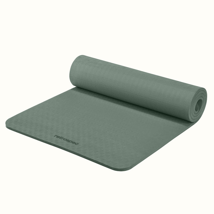 Partially rolled out Sage Zuma Yoga Mat with textured surface on a white background.