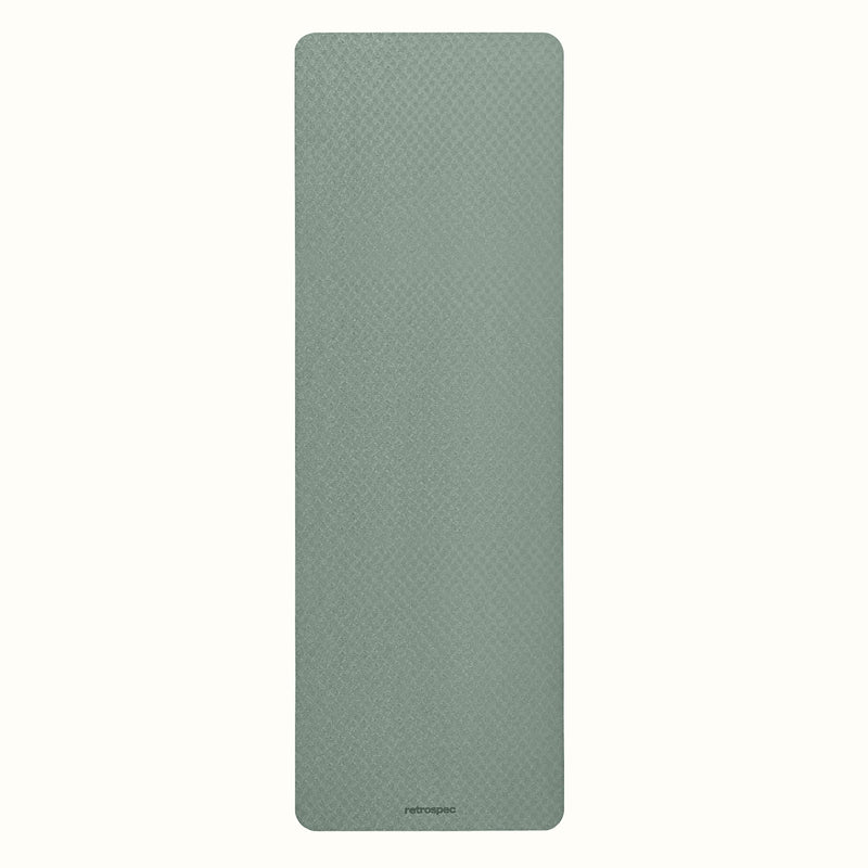 Sage Zuma Yoga Mat with textured surface on a white background.