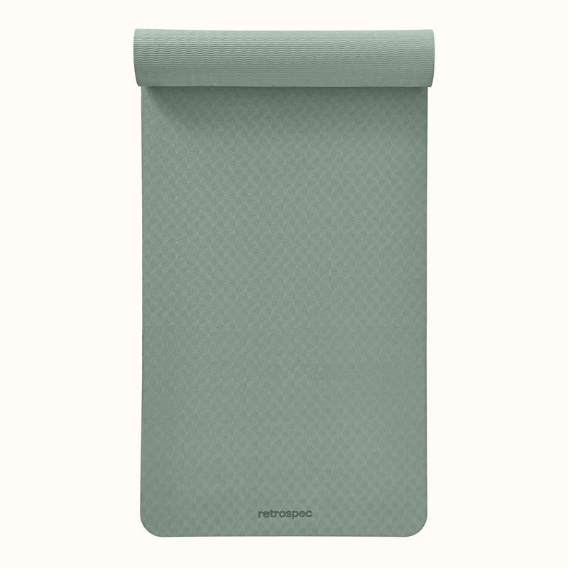 Partially rolled out Sage Zuma Yoga Mat with textured surface on a white background.