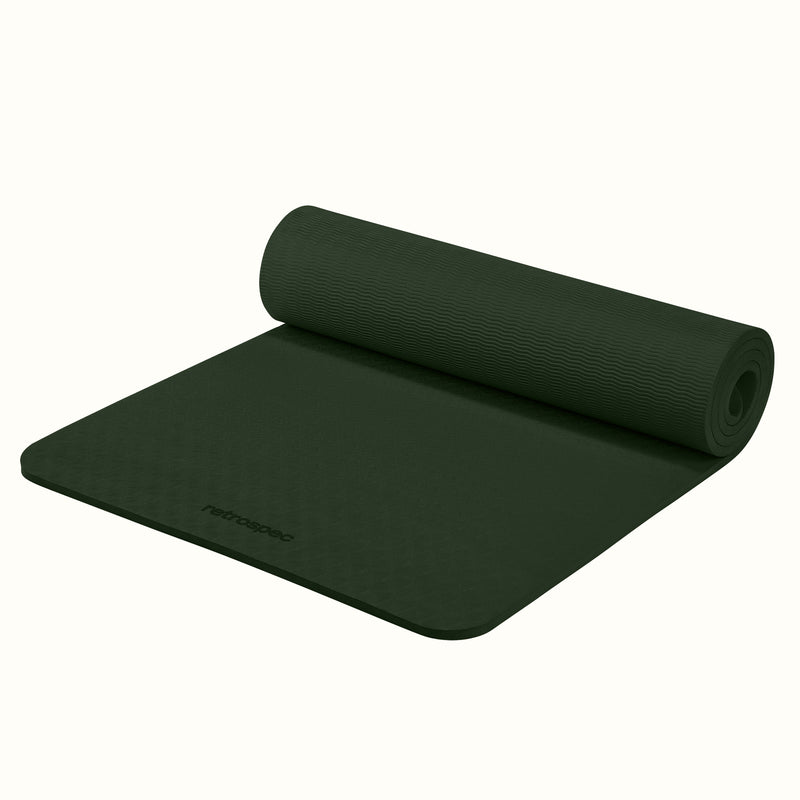 Partially rolled out Wild Spruce Zuma Yoga Mat with textured surface on a white background.