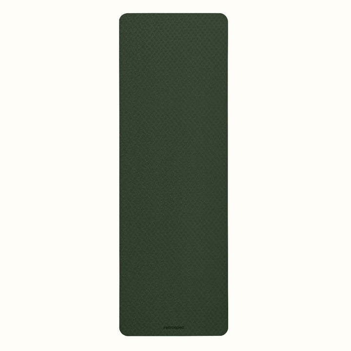 Wild Spruce Zuma Yoga Mat with textured surface on a white background.