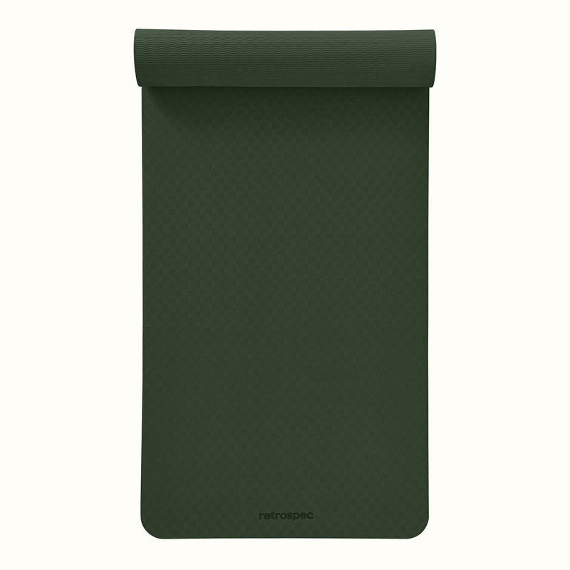 Partially rolled out Wild Spruce Zuma Yoga Mat with textured surface on a white background.