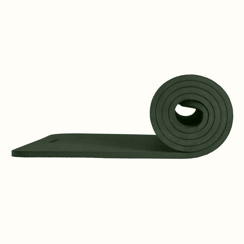 Wild Spruce Zuma Yoga Mat partially rolled on a white background, showing texture and thickness.
