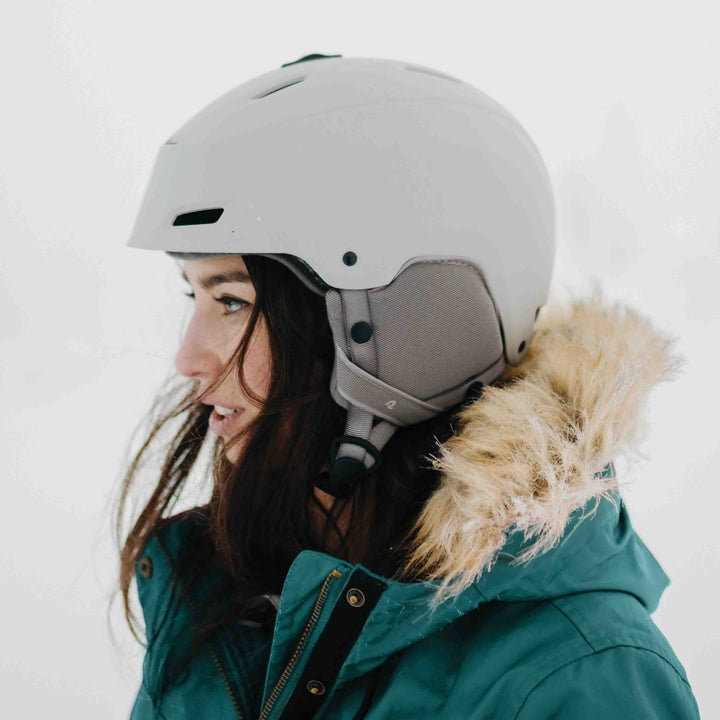 Side profile of the retrospec Zypher womens ski helmet, showing its vented ear pad design.